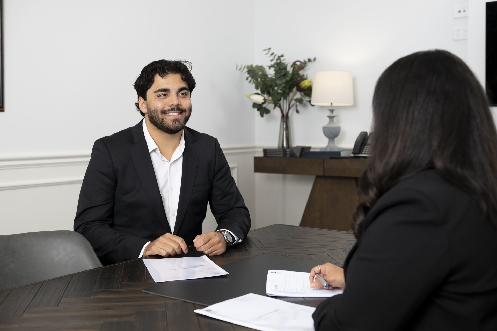 Two Solomon Hollett team members engaged in a discussion
